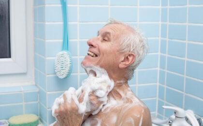 senior man washing his body soap