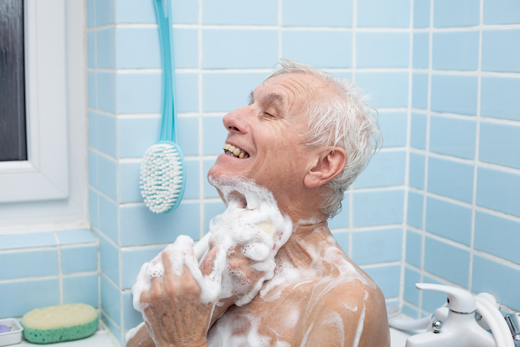 senior man washing his body soap