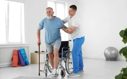 physiotherapist working senior patient rehabilitation