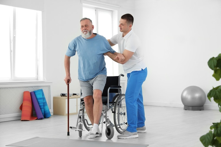 physiotherapist working senior patient rehabilitation
