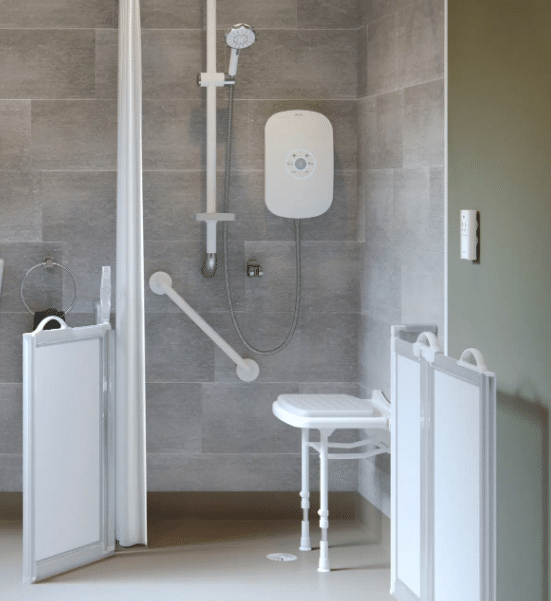 a shower with a seat and a chair