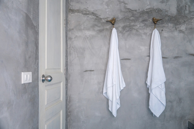 hanging white towel in bathroom