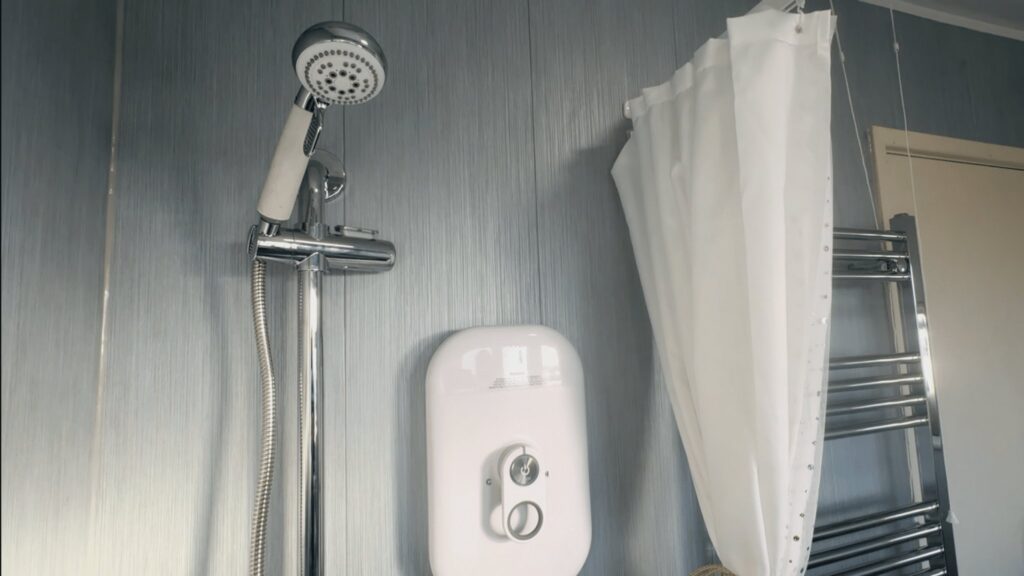 Close-up of the easy-to-use electric shower and handheld head in Mark's wet room.