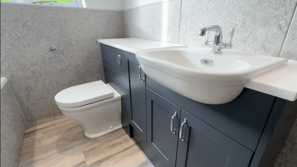 The vanity unit in Stephen's new bathroom, with an integrated sink, back-to-wall comfort-height toilet and chrome fixtures.