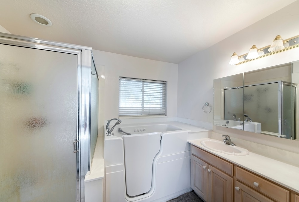 A walk in bathtub in bathroom