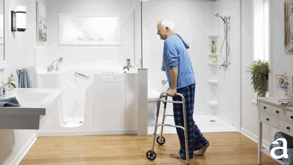 Elderly man walking with support in walk-in bathroom