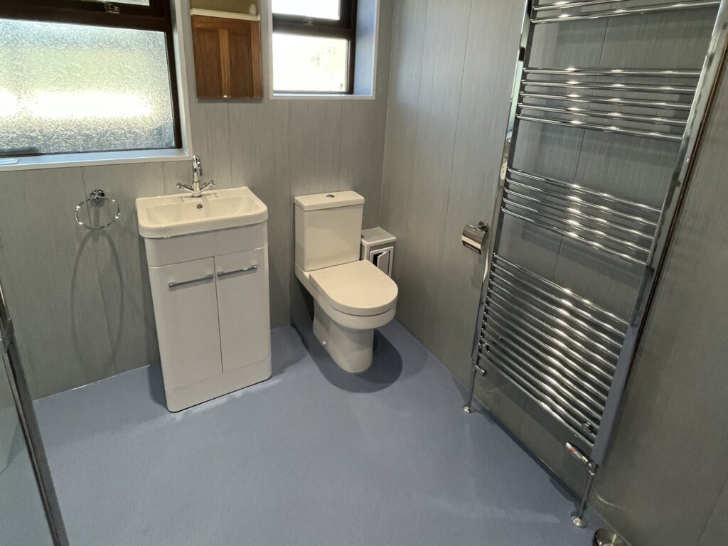 Bruce's new vanity basin, toilet and tall heated towel rail.