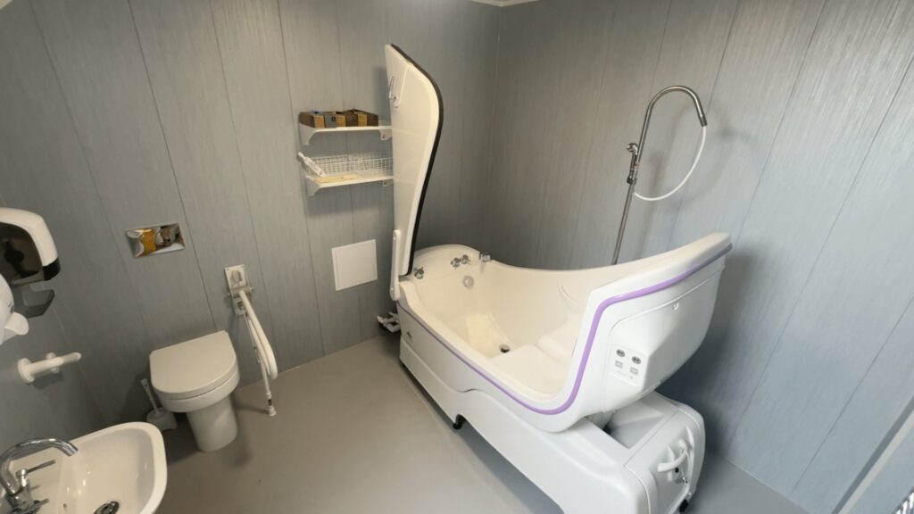 The new assisted care bath in Room 3, with a side-opening door, height adjustment and a handheld shower.