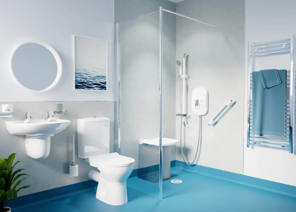 Modern accessible wet room with level access shower, fold-down shower seat, grab rails, toilet, sink, heated towel rail, and blue safety flooring