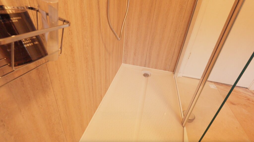 The level, anti-slip shower tray in Edward's walk-in shower, with barely any lip to step over.