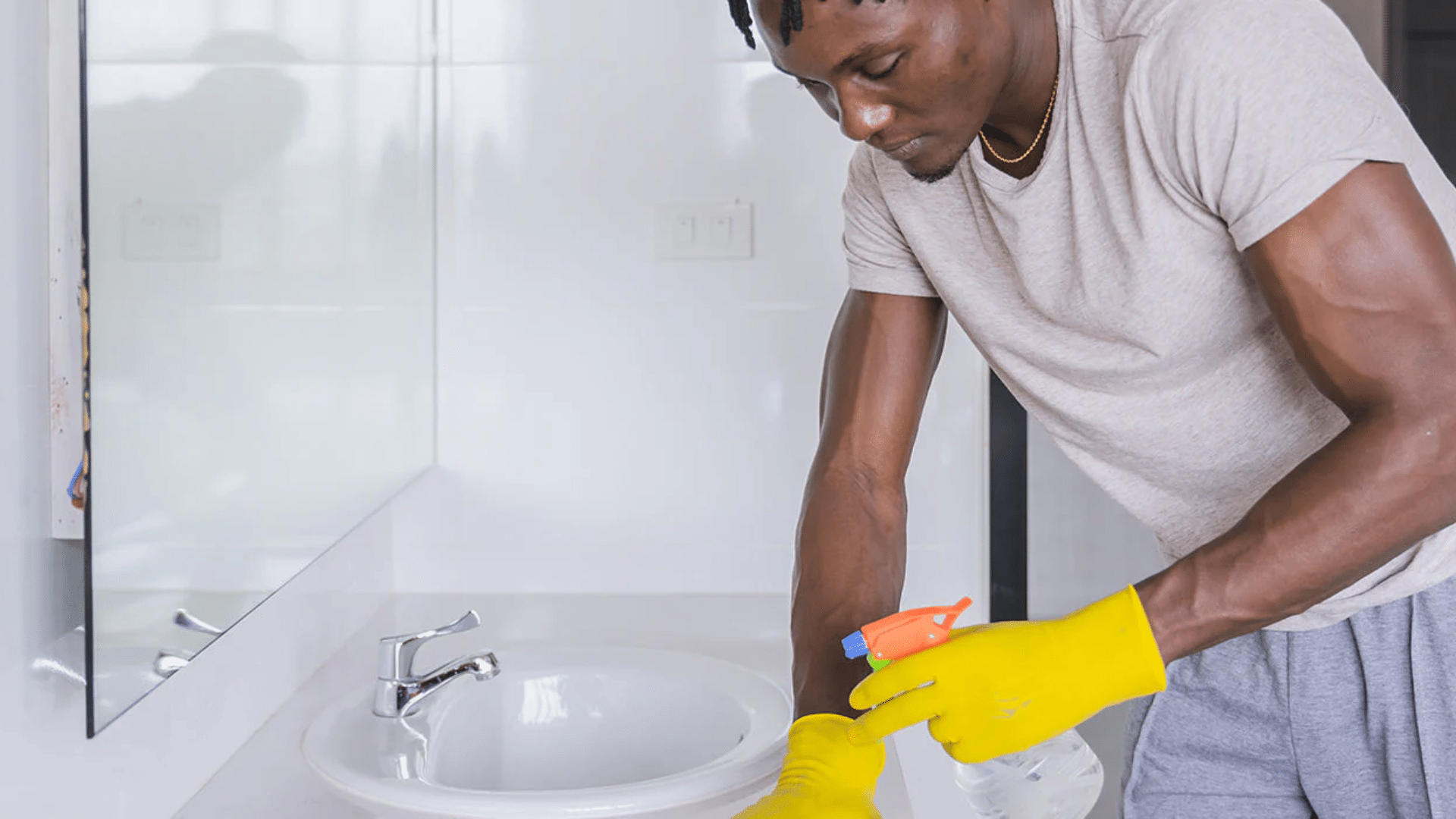 Person Cleaning Bathroom