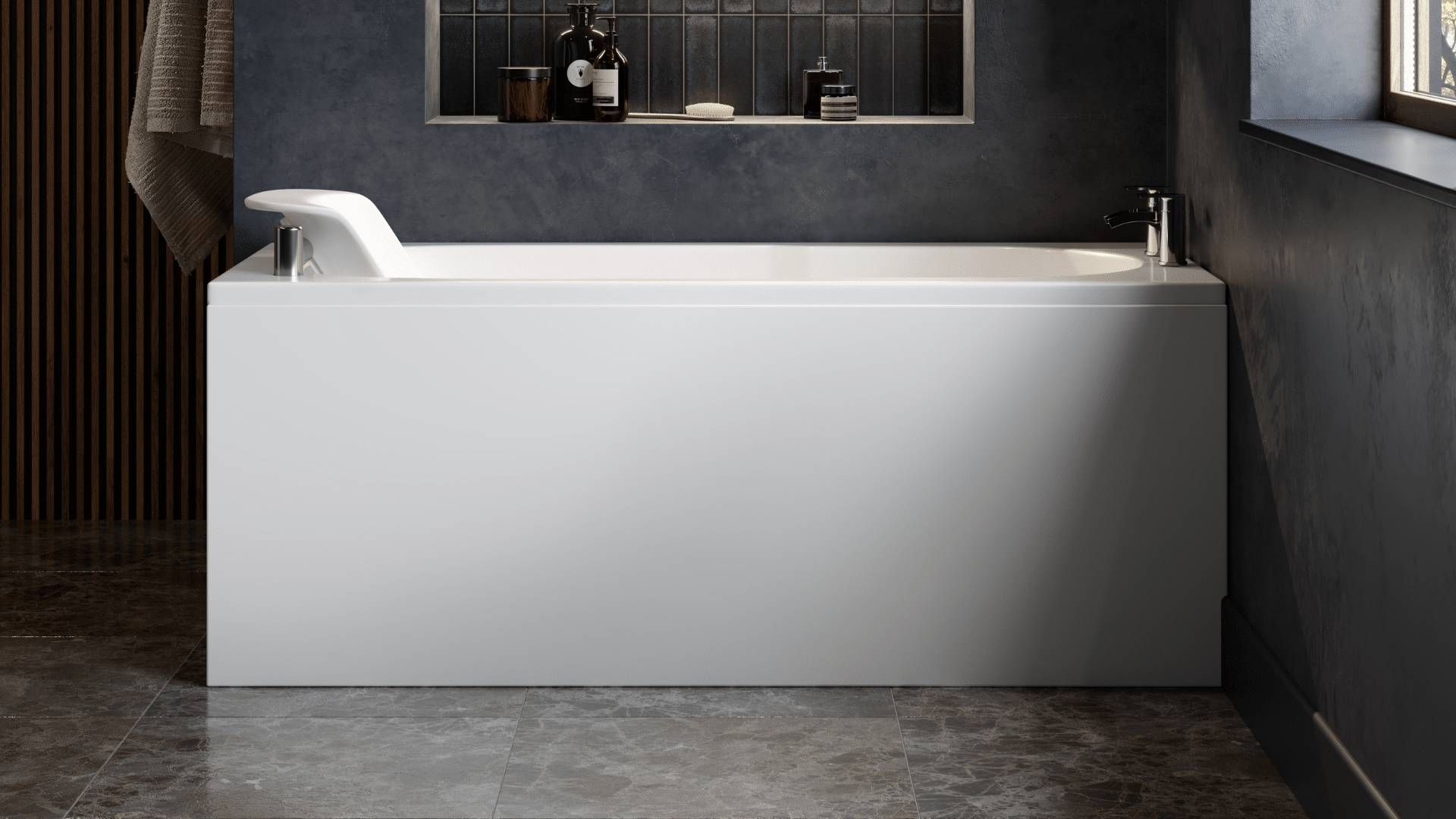 A modern white Omega powered seat walk-in bath featuring an integrated powered seat that remains at the top edge of the tub for easy entry. The bath includes a high-gloss front panel, chrome fixtures, and a recessed wall niche for toiletries, set against a contemporary grey textured wall and dark floor tiling.