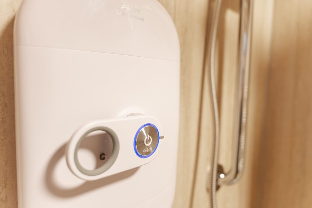 The easy-to-use lever control on Samantha's electric shower, with a large illuminated on and off button.