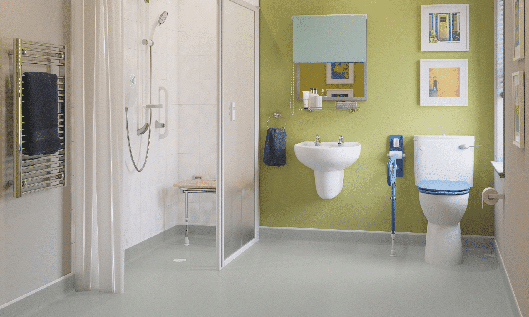 Photo of a mobility bathroom/wet room with a walk-in shower, fold-down seat, and green accent wall.