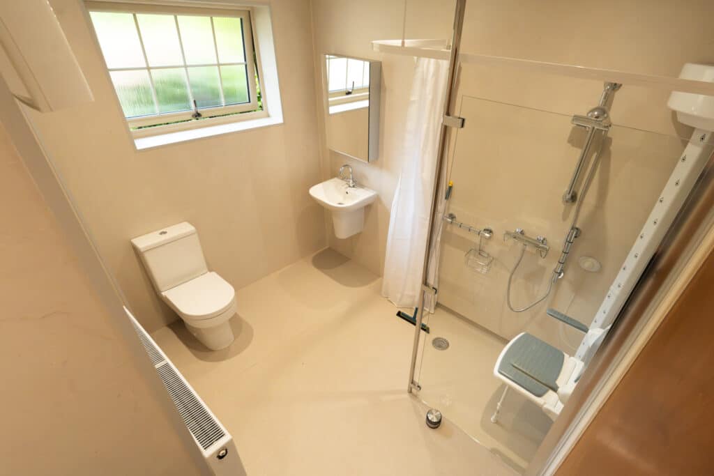 Full view of wet room installation designed and completed by Age Care Bathrooms.