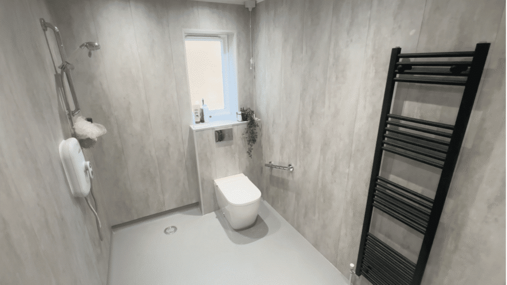 A wheelchair-friendly wet room, designed and installed by Age Care Bathrooms.