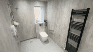 A wheelchair-friendly wet room, designed and installed by Age Care Bathrooms.
