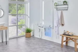 The Easy Riser walk-in bath with air spa running, in a bright bathroom