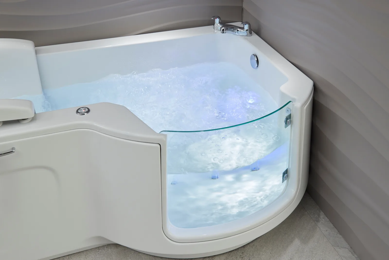 Close-up of the Louisiana bath with the air spa running and blue chromotherapy light