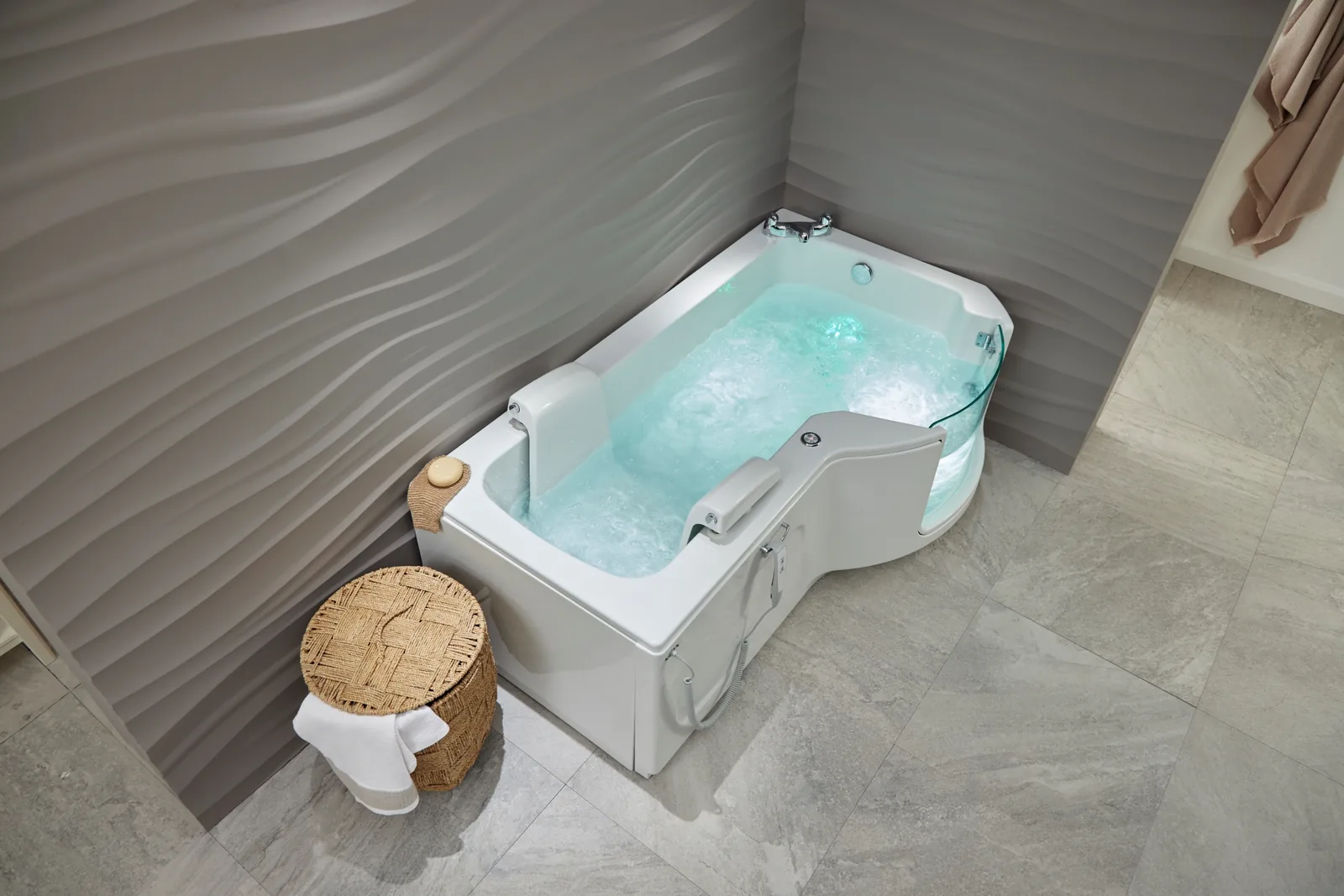 The Louisiana walk-in bath with the air spa running, in a bright modern bathroom