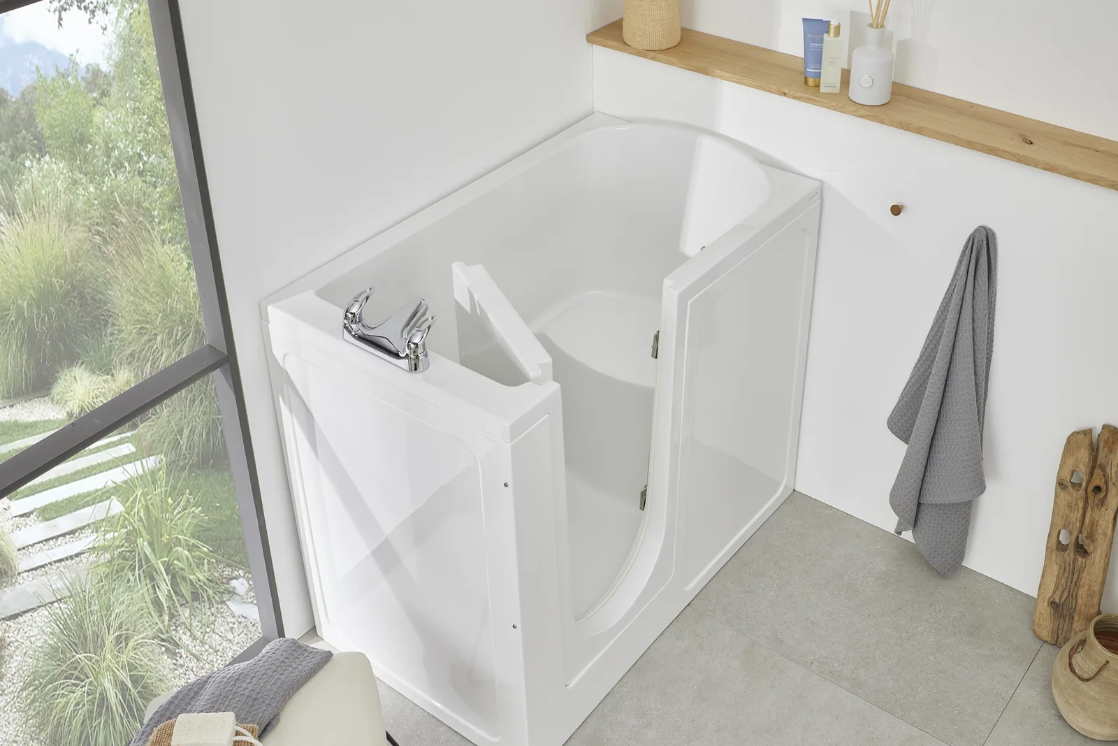 The Oregon walk-in bath with its inward-opening door open, in a bright bathroom