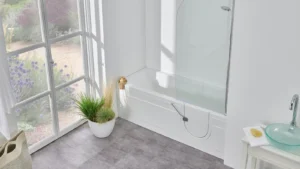 Angled view of the Arizona walk-in bath with its curved glass shower screen