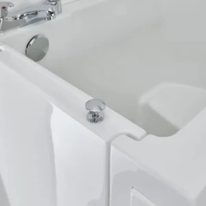 Close-up of the Florida walk-in bath's moulded seat and chrome tap