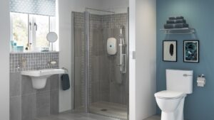 Level-access curbless shower by Age Care Bathrooms, with a glass screen, grab rail and step-free drainage.