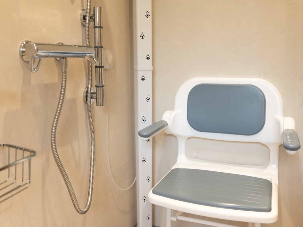 The shower corner in Zoey's wet room, with a thermostatic shower, body dryer column and padded fold-down seat