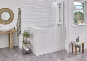 The Georgia walk-in bath with a glass shower screen and door closed, in a bright bathroom