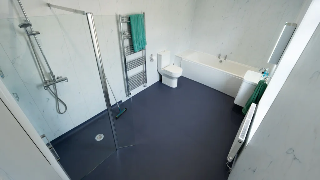 Wide angle of Peter's new accessible bathroom with "newt" non-slip flooring.