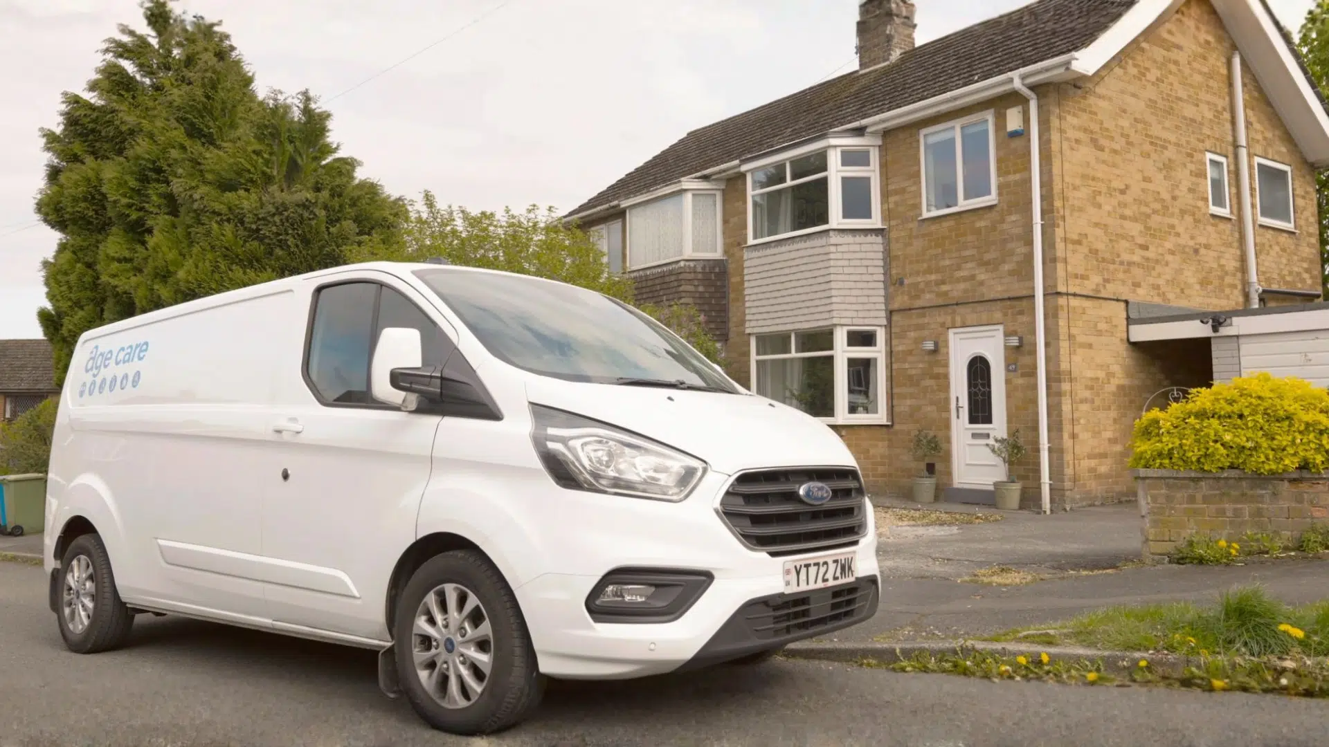 An Age Care Bathrooms van parked outside a customer’s house