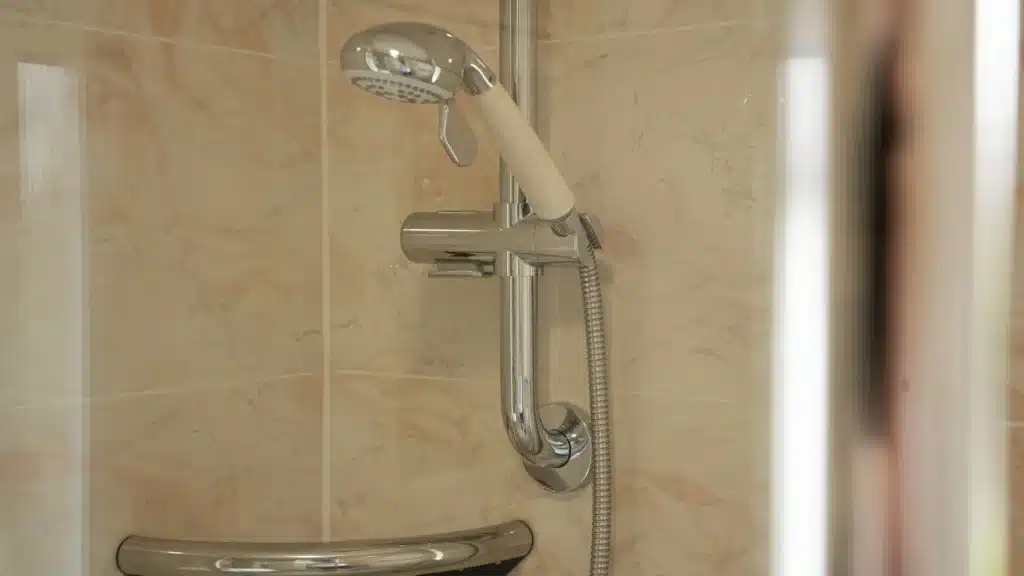 Close-up of Paul's brand new shower on an adjustable rail.
