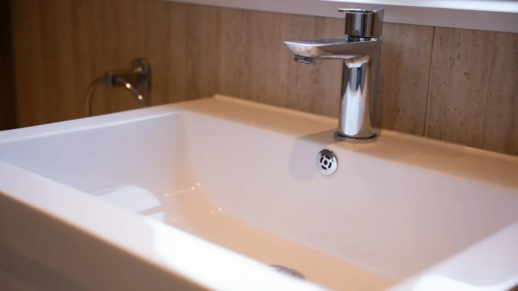 Close-up of Tom's new basin and tap in his wet room.