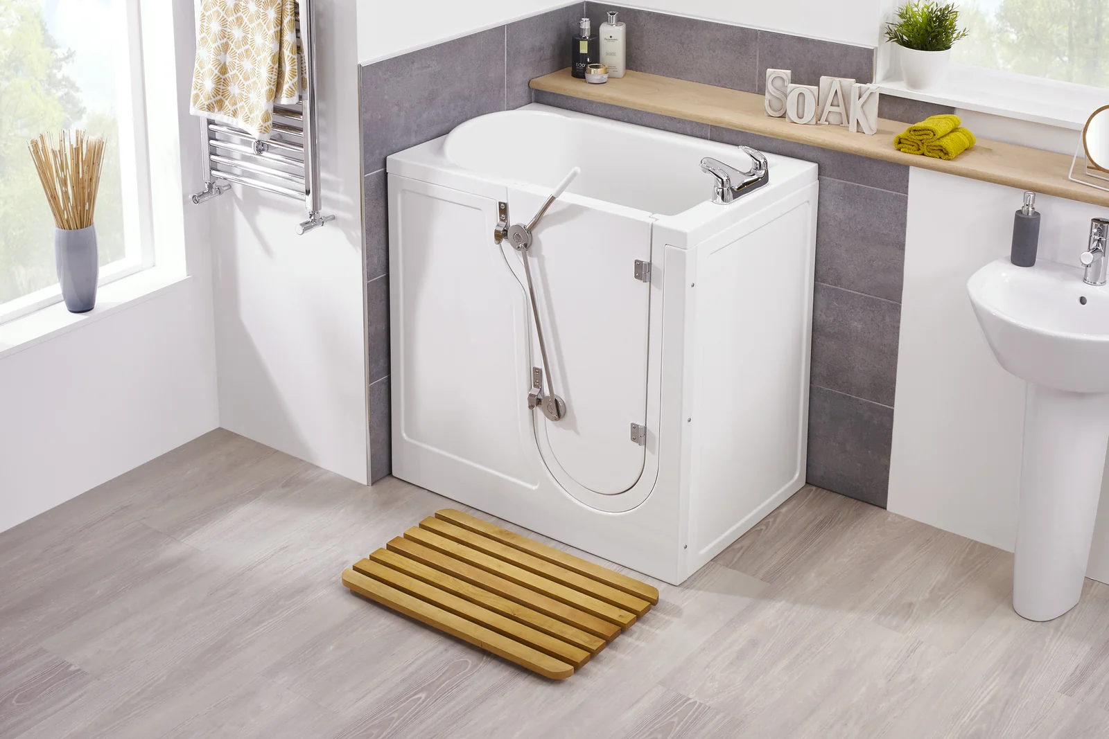 Compact walk-in bath, the Vermont, in a spacious bright bathroom. Supplied and installed by Age Care Bathrooms.