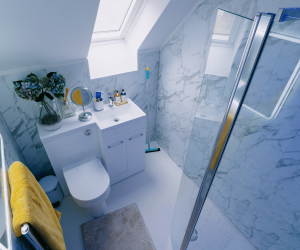 Seamless safety and style. We gave Sophie a full wet room installation, removing her challenging high-step shower. The result is a stunning, level-access space that fully supports her independent bathing.
